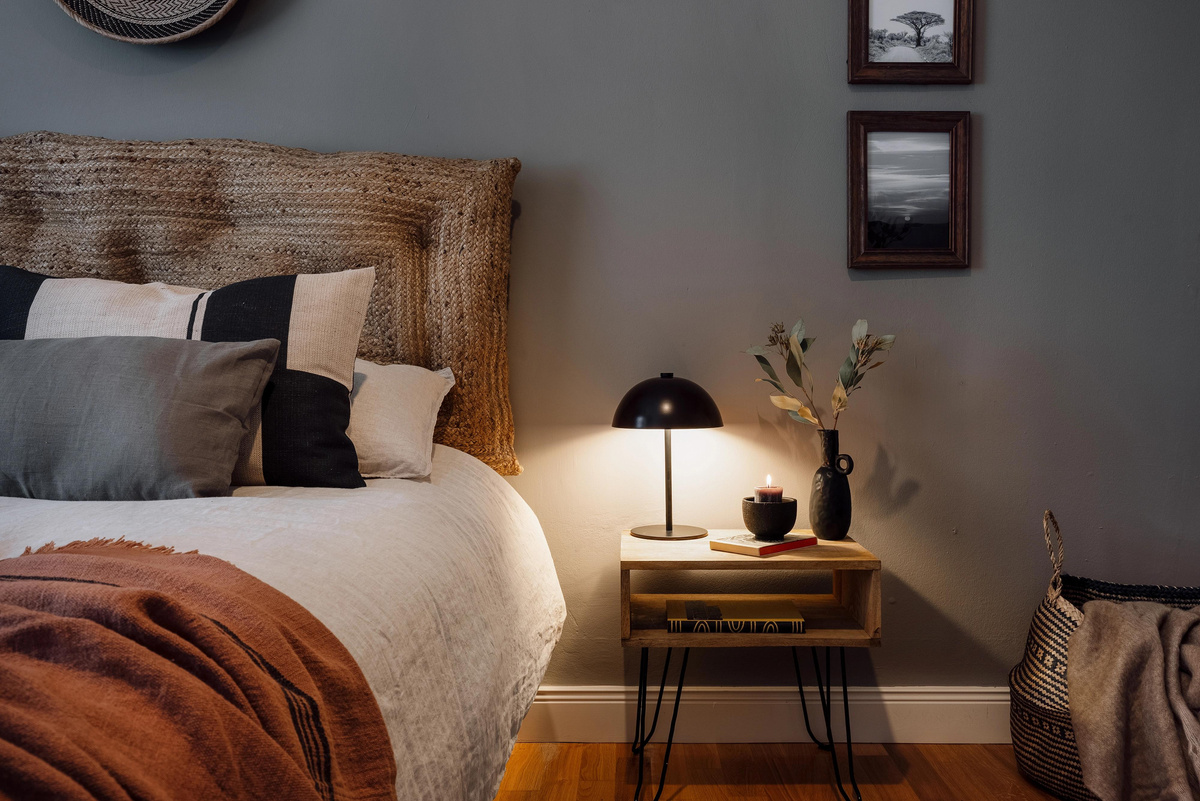 a bedroom with a bed, a nightstand and a clock on the wall. Bedroom design, kids bedroom designer, zara home style, interior design help, VT wonen, Aptó interiors, Architectural Digest, Elle decoration. Noelle Baartmans designer.